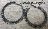 Hematite & black spiked 2 1/2’ hoop earrings, ;are black hoop earrings