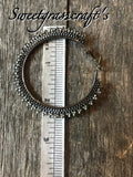 Hematite & black spiked 2 1/2’ hoop earrings, ;are black hoop earrings