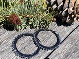 Hematite & black spiked 2 1/2’ hoop earrings, ;are black hoop earrings
