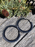 Hematite & black spiked 2 1/2’ hoop earrings, ;are black hoop earrings