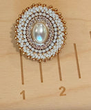 Cream gold oval pearl & bows beaded earrings