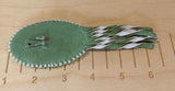 Swirling green oval beaded earrings with leather fringe