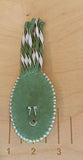 Swirling green oval beaded earrings with leather fringe