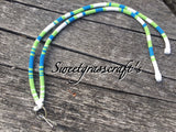 Blue, green and white lanyard